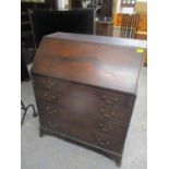 A 19th century mahogany bureau having a fall flap above four graduated drawers 39 1/2"h x 34 3/4" w