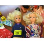 A 1970s Sindy doll with a quantity of retro clothing, together with a 1980s Sindy doll, horse and