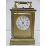 A 19th century French Henry Marc repeater carriage clock in a brass case and having a white enamel