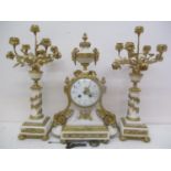 A 19th century French gilt metal mounted and white marble clock garniture. The convex dial having