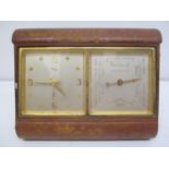 An early 20th century IMHOF travel clock and Veranderlich barometer in a leather folding case. The