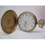 An early 20th century Zenith 9ct gold full Hunter, keyless wound pocket watch. The white enamel dial