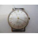 An Oriosa gents 14ct gold, manual wind wristwatch. The silvered dial having baton markers and centre