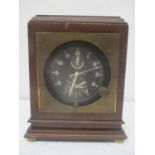 An 8 day aircraft clock having a black dial with Arabic numerals and subsidiary dials, AM/PM and