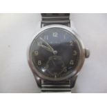 A 1940s Mimo gents stainless steel, manual wind wristwatch. The black dial having Arabic numerals