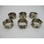 A set of six Iranian, Persian silver Niello napkin holders decorated with images of sailing boats,