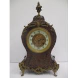 A late 19th century French Boulle mantle clock. The dial having a pierced gilt centre and enamel