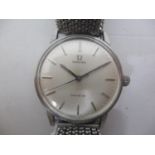 An Omega Geneve gents stainless steel, manual wind wristwatch having a silver dial, baton markers