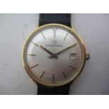 An Eterna Matic gents 9ct gold automatic wristwatch having a silvered dial, baton markers, date