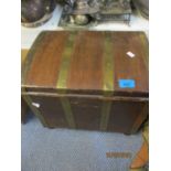 An early 20th century oak coal bucket in the form of a domed casket with brass strapwork and handles