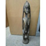 An African carved wooden tribal art figurine 34"h