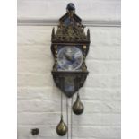 A Dutch reproduction mahogany and brass cased wall clock with blue and white tiles