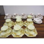 A Grafton china Aston part tea service, yellow ground with yellow flowers, together with a Royal