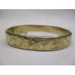 A 9ct gold bangle