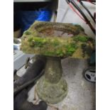 A weathered stoneware garden birdbath, 20" h x 12"w