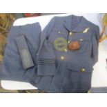 An RAF WWII tunic with observer cloth badge and trousers, a leather cased compass and navigation