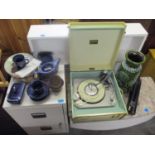 A Dansette record player in a cream and green case, on legs, a West German vase, decorative plates