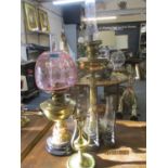 Two Victorian oil lamps and three smaller lamps