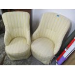 A pair of Victorian salon chairs upholstered in a yellow and white fabric, on turned mahogany legs