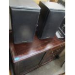 A reproduction mahogany music cabinet containing a Technics stacking system with speakers