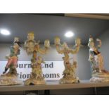 A pair of porcelain candelabras and a pair of figural stands Location: