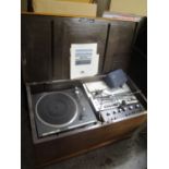 Mixed audio equipment to include a Pioneer turntable and a Sansui amplifier, contained in a