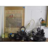 A mixed lot to include table lamps, clocks and a 1936 Daily Mail framed newspaper advertising RMS