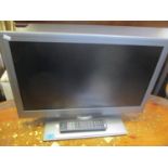 A Linsar 26" television with built in DVD player