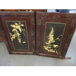 A pair of lacquered oriental panels with inlaid bone flora and birds A/F