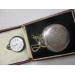 A Victorian silver Hunter pocket watch and a Continental silver fob watch and bronze powder