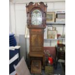 A Georgian mahogany long case clock having an arch topped dial with an 8-day movement with