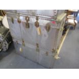 A pair of modern aluminium twin handled trunks 21"h x 40"w