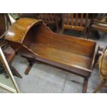 A walnut hooded cradle circa 1790 on T shaped original stand with bobbin turned stretcher, 32" h, 36