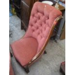 A Victorian mahogany button back low chair upholstered in pink with cabriole legs