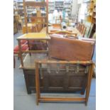 A folding suitcase rack, a vintage suitcase and an early 20th century occasional chair (the coffer