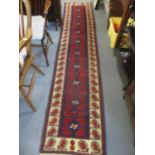 Two Middle Eastern rugs having geometric designs and multiguard borders