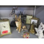 Three carriage clocks to include Metamec, a brass bell, models of dogs and a Royal Mint George & The