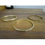 An 18ct yellow gold bracelet with fluted decoration 13.25g, a 14ct yellow gold bracelet 11.8g, and a