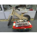 Circa 1960 a wooden framed child's Early Rider bike, and a quantity of board games
