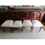 Three Edwardian walnut and inlaid salon chairs with upholstered seats on turned front legs, and an