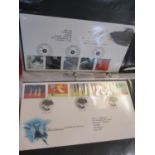 A quantity of First Day Cover albums with contents, loose stamps and proof sets