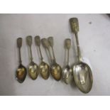 A set of six Fiddle pattern teaspoons initialled and with floral engraved decoration, and a silver