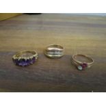 Three gold rings to include a 9ct gold five graduated amethyst stone ring, a 585 14K rose gold