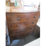 A mahogany bow fronted chest of two short and three long drawers, oak drawer linings, bracket
