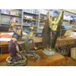 A group of three Academy composition resin figurines in the Deco style, each depicting a female