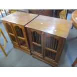 A pair of modern cabinets having spindle front cupboard doors with a single drawer below 29 1/2"h