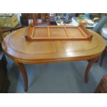 A modern Oriental extending dining table 30 1/4"h x 66"w and a set of eight chairs