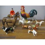 Beswick ornaments to include a red coated huntsman and horse, a hunter, two foxes, three hounds, a