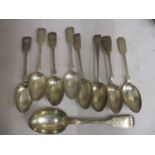 Eight silver dessert spoons and a tablespoon, each with engraved decoration, 407g