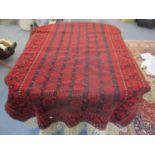 A Persian red ground rug having multi-guard borders, geometric designs and tasselled ends 85" x 48"w